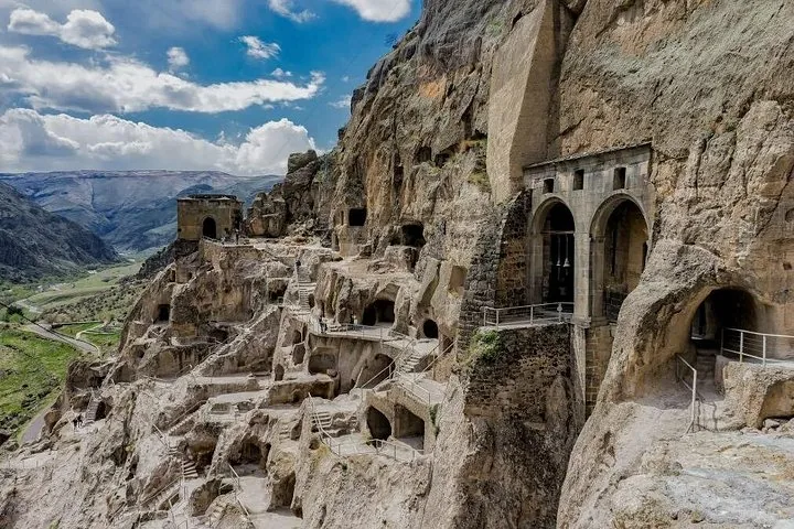 Exterior view of the Vardzia cave monastery with stone archways and carved rooms